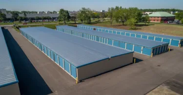 Aerial view of enclosed drive-up storage units at self storage facility.