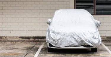 Parked car with protective covering